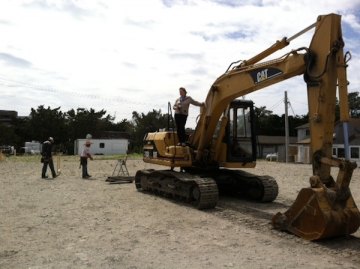 Local reporter Connie Leinbach climbed the heavy equipment for a good view. Her story about the groundbreaking is posted on islandfreepress.org
